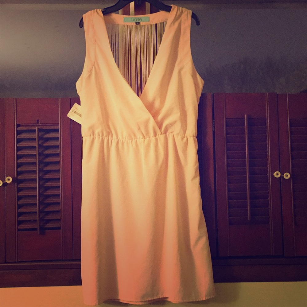A mid-thigh light pink dress